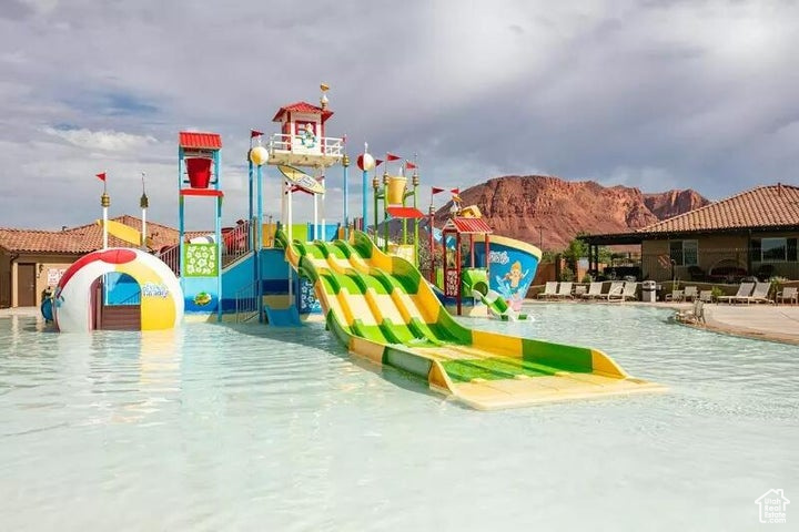 View of jungle gym with a mountain view