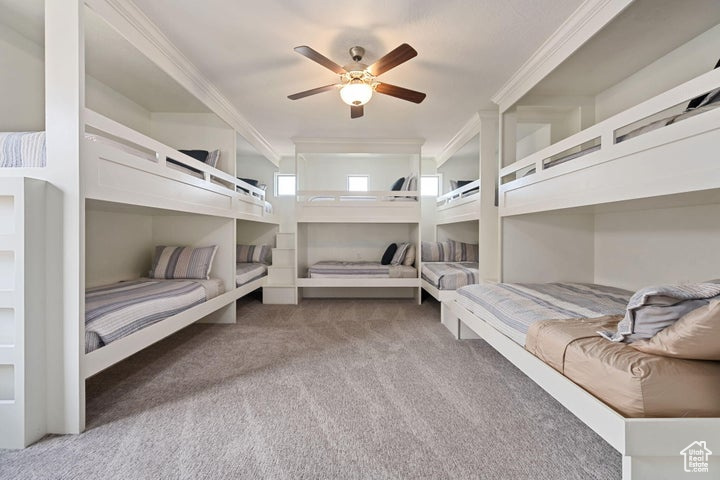 Bedroom with carpet flooring and ornamental molding