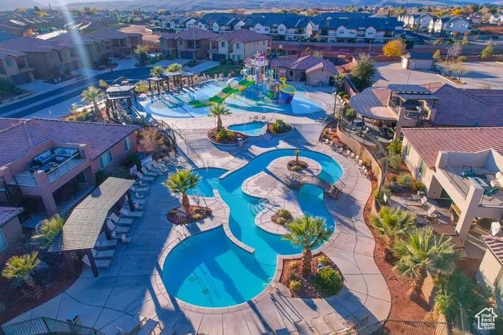Aerial view of residential area featuring a pool area