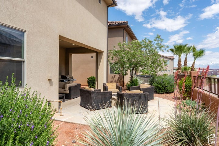View of patio featuring an outdoor hangout area