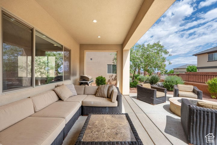 View of patio / terrace with an outdoor living space, area for grilling, and fence