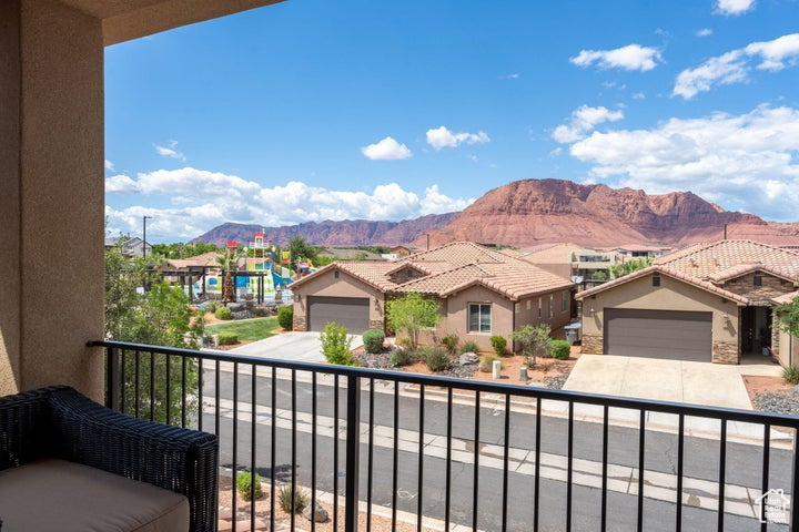 Balcony featuring a mountain view and a residential view