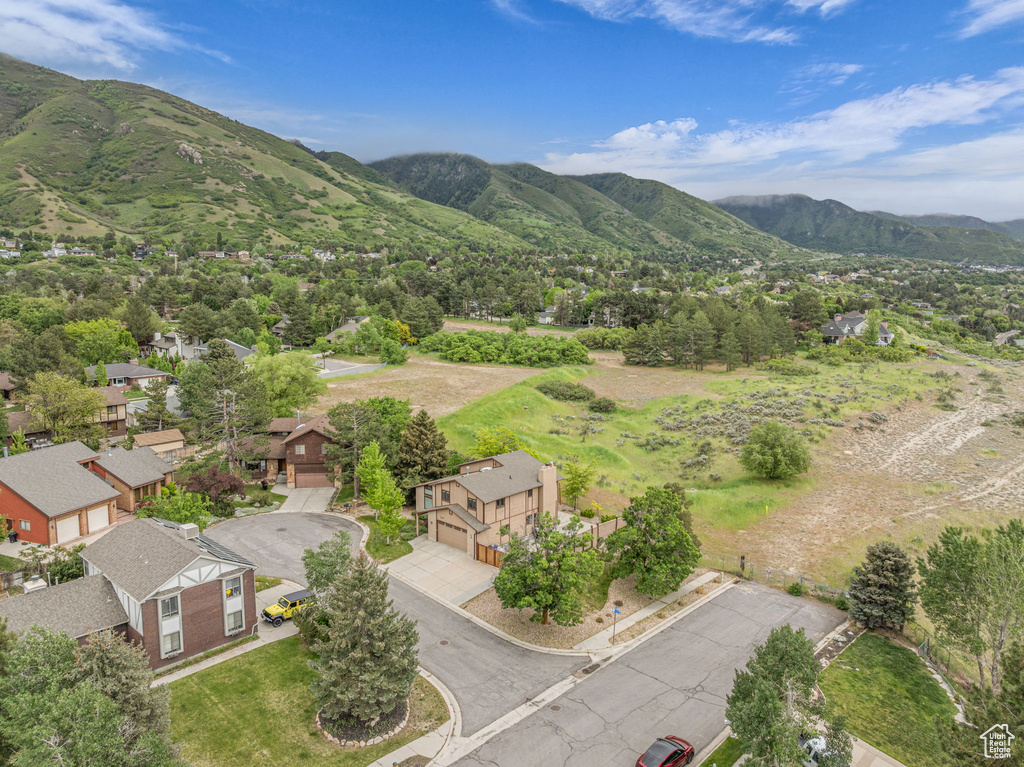 Aerial view of residential area featuring mountains