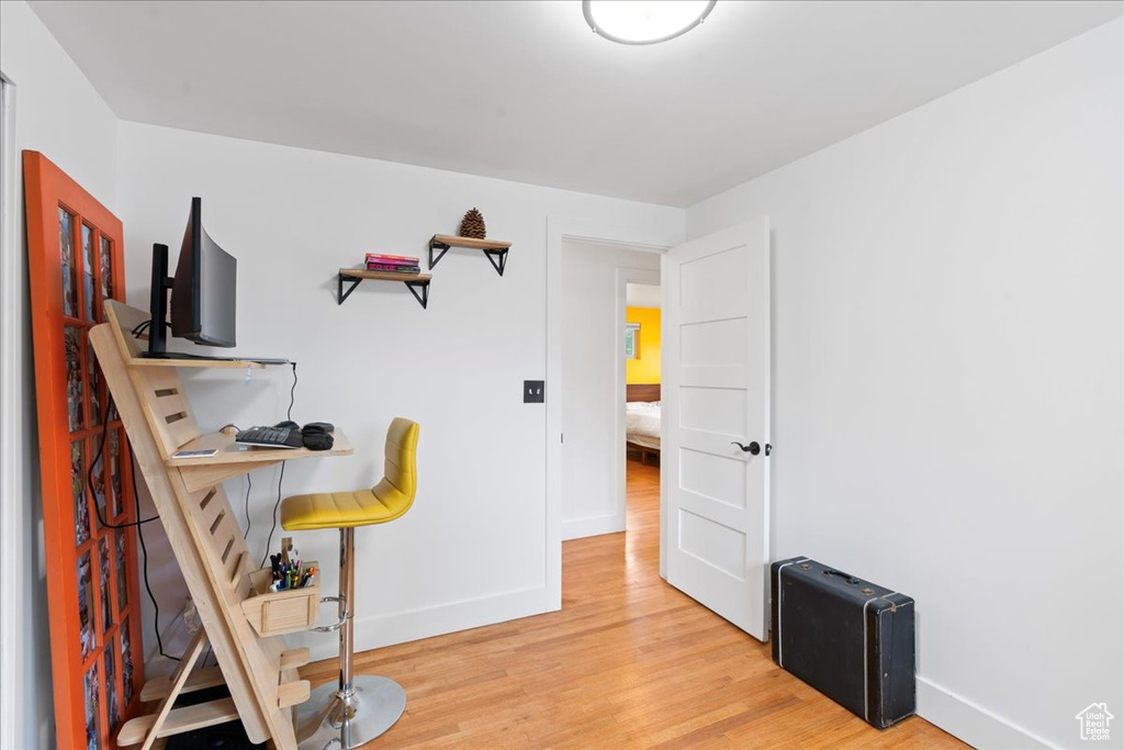 Bedroom with baseboards and light wood-style floors