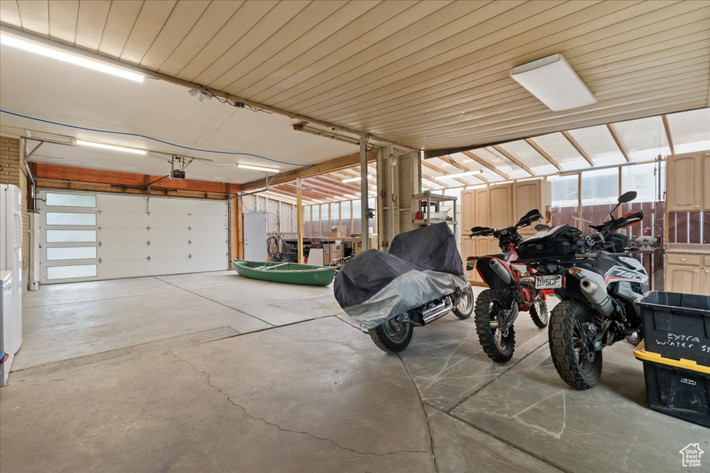 Garage featuring a garage door opener