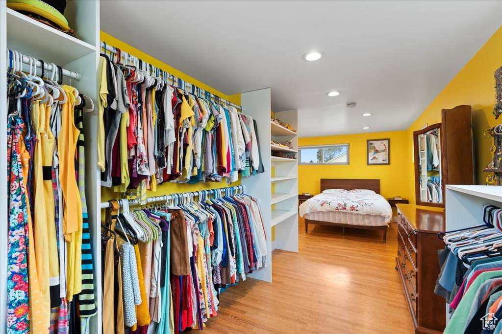 Walk in closet featuring wood finished floors