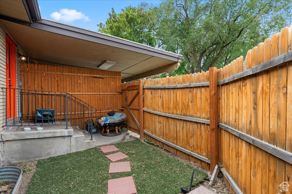 View of yard featuring fence