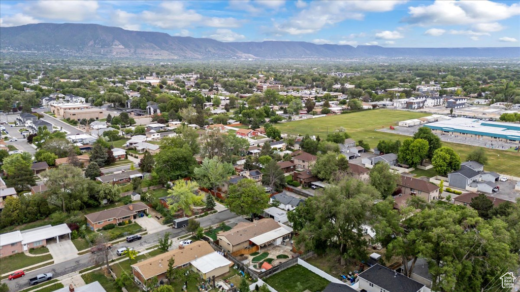 View of property location with a mountainous background and nearby suburban area