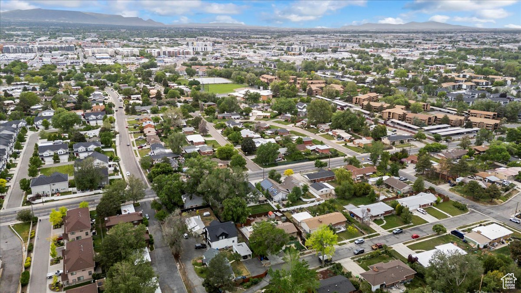 Aerial view of property\'s location with a mountain backdrop and nearby suburban area