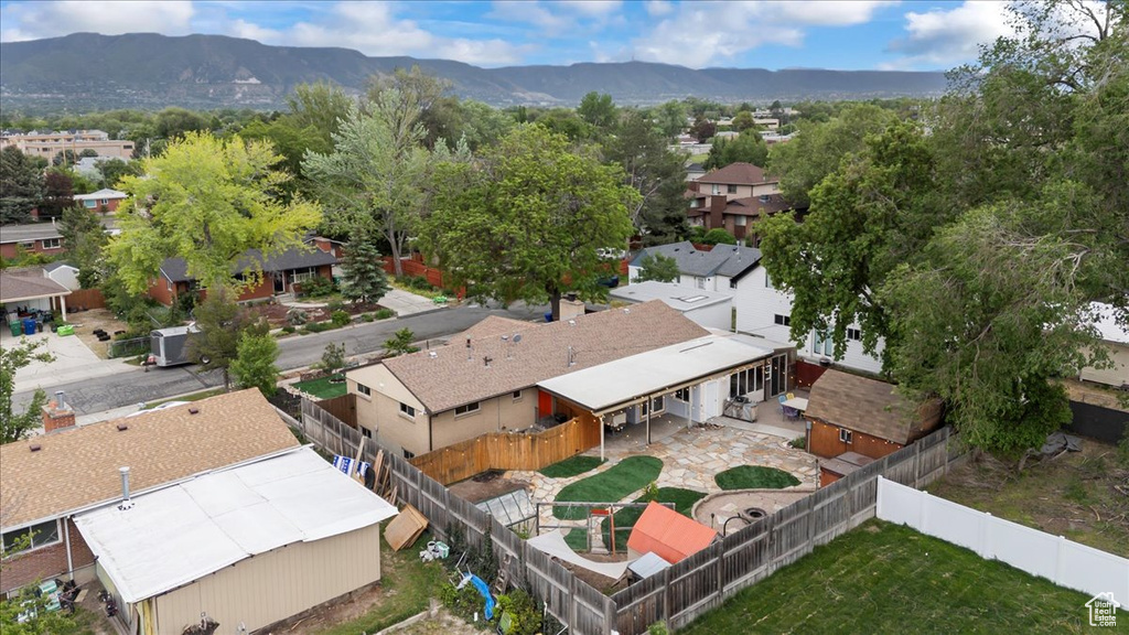 Aerial perspective of suburban area featuring a mountainous background