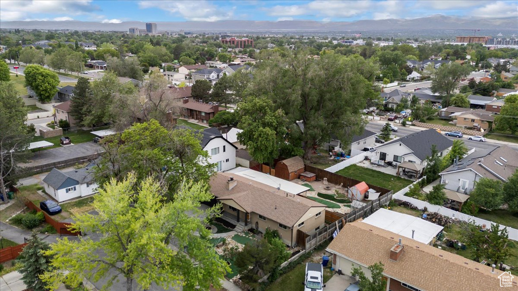 Aerial perspective of suburban area with a mountainous background