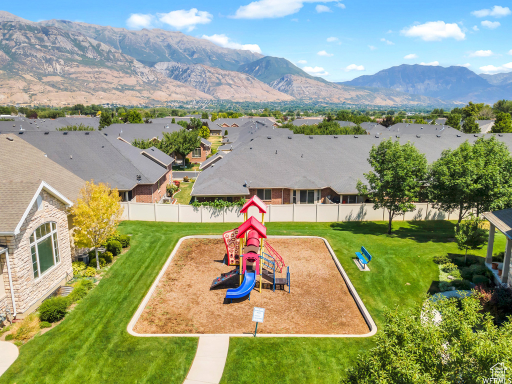 Community jungle gym with a residential view and a mountain view