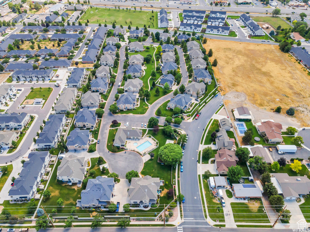Aerial view of property's location featuring nearby suburban area