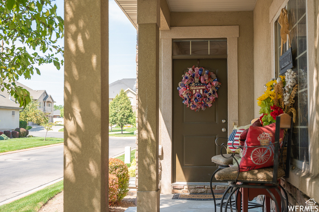 Entrance to property featuring stucco siding