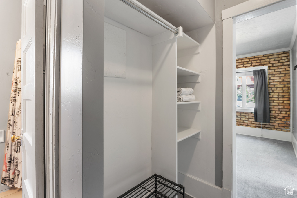 Walk in closet with carpet
