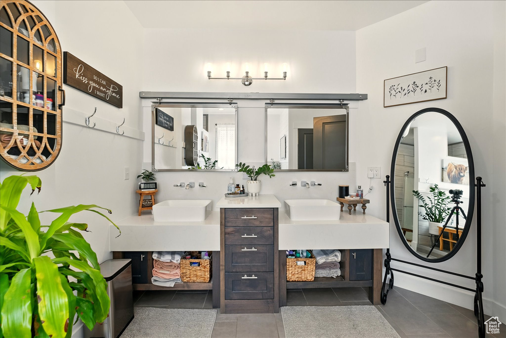 Bathroom with tile patterned flooring and vanity