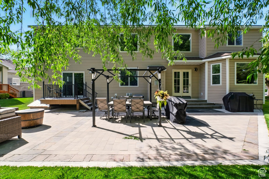 Rear view of property with a patio area