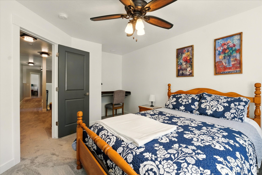 Bedroom with carpet flooring and a ceiling fan