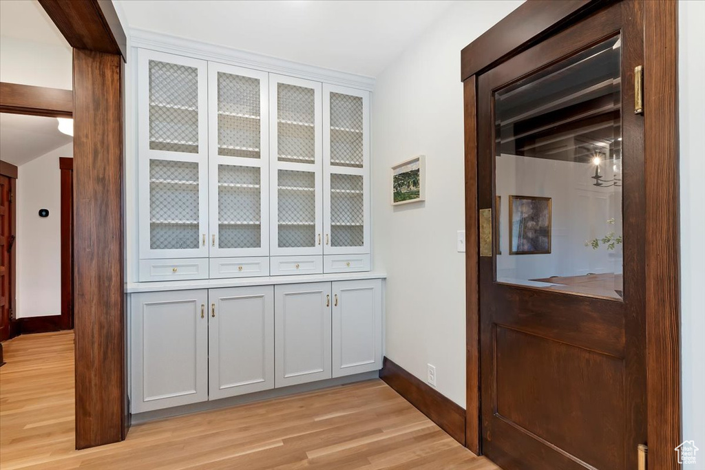 Detailed view of wood finished floors and baseboards