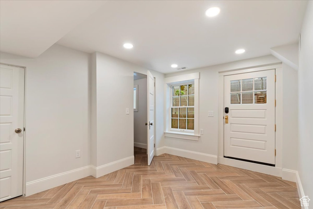 Foyer entrance featuring baseboards and recessed lighting