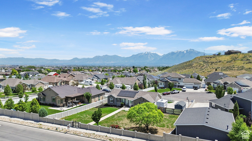 View of mountain backdrop featuring nearby suburban area