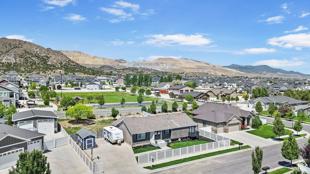 View of mountain backdrop featuring nearby suburban area