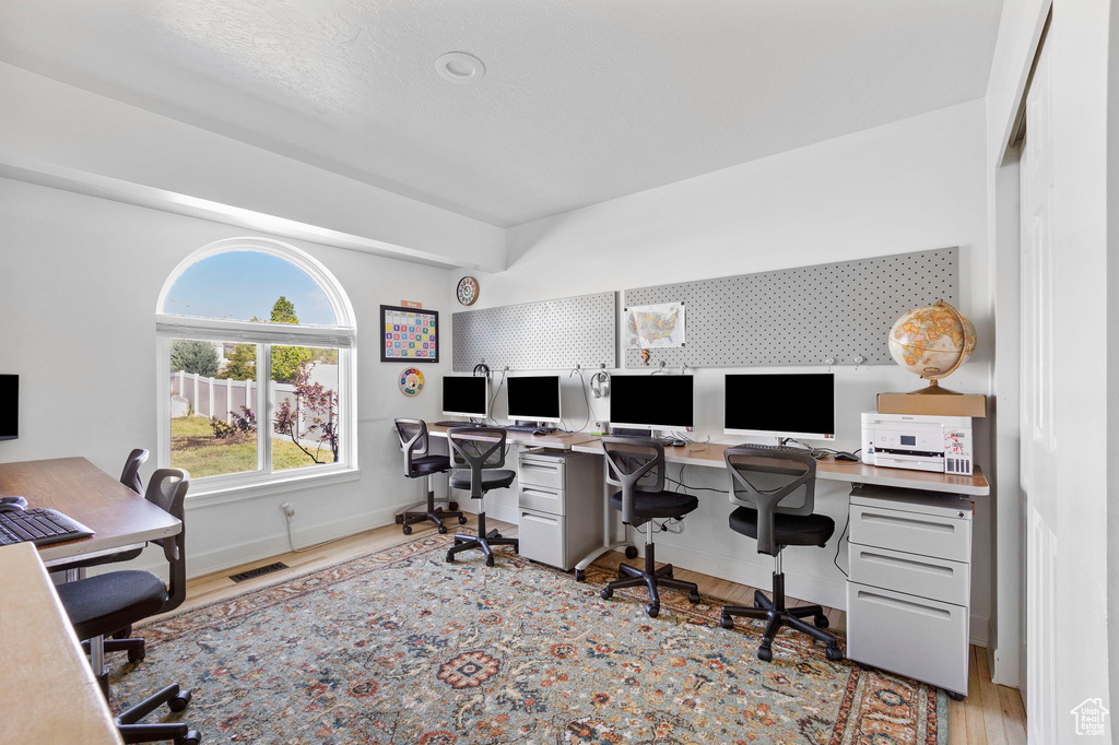 Office featuring wood finished floors and baseboards