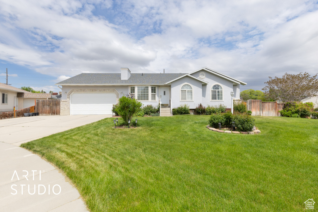 Single story home featuring driveway, an attached garage, stucco siding, and roof with shingles