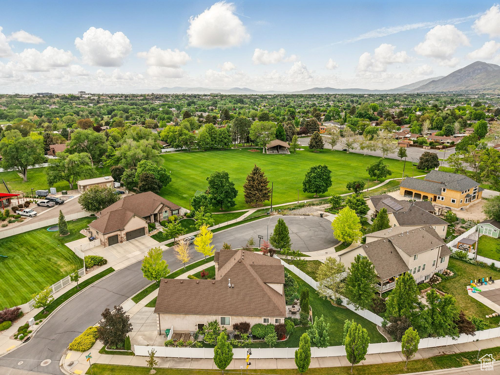 Aerial perspective of suburban area with a mountainous background