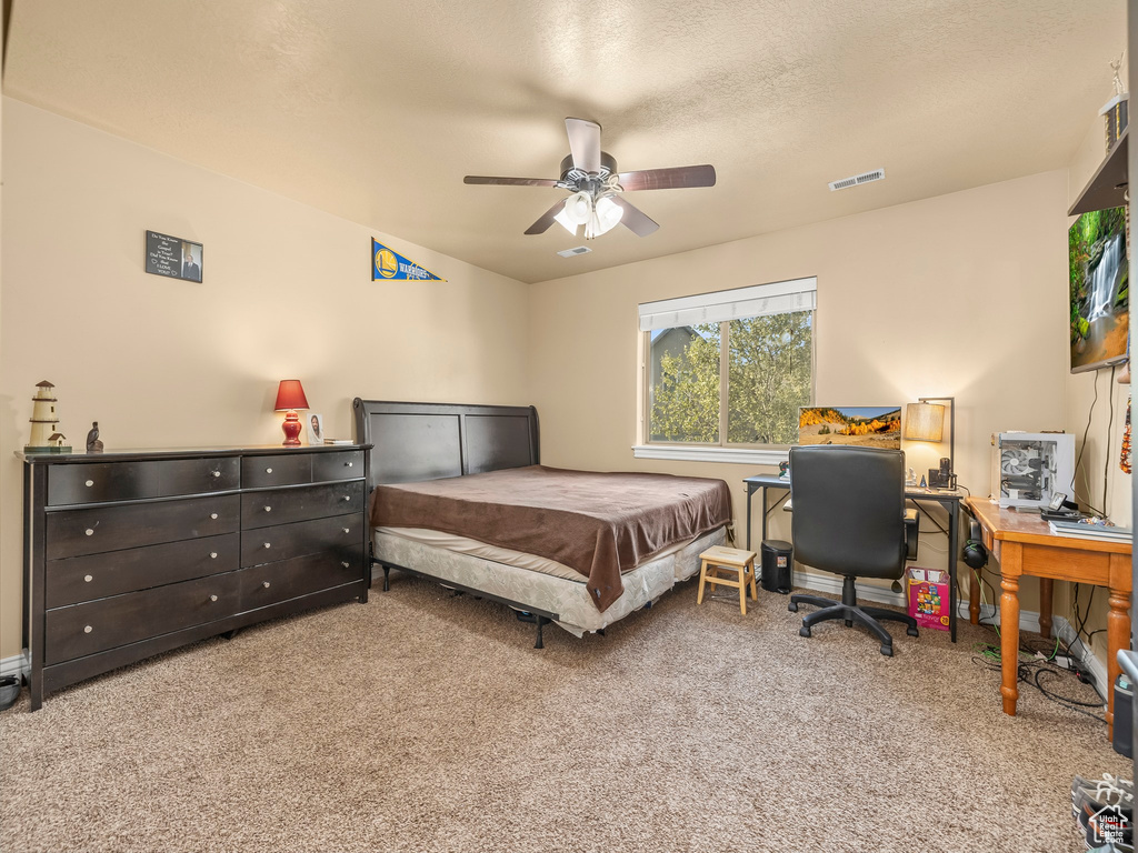 Bedroom with carpet and ceiling fan