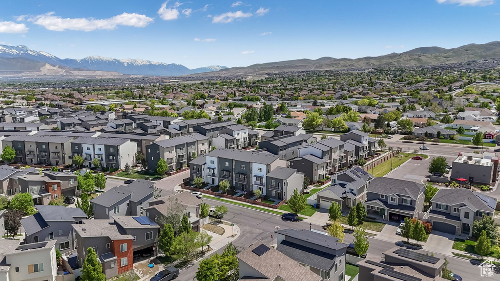 Aerial view of residential area featuring a mountain backdrop