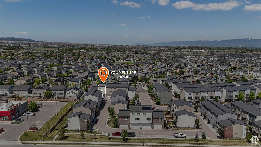 Aerial view of residential area featuring mountains