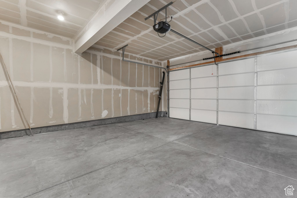 Garage featuring a garage door opener