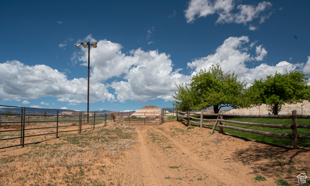 View of yard featuring a view of countryside and fence