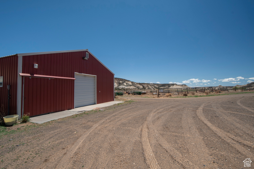 View of dirt / gravel road with a mountain view