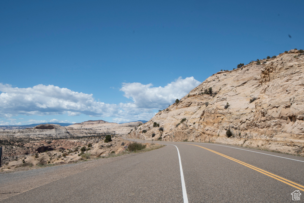 View of asphalt street with a mountain view