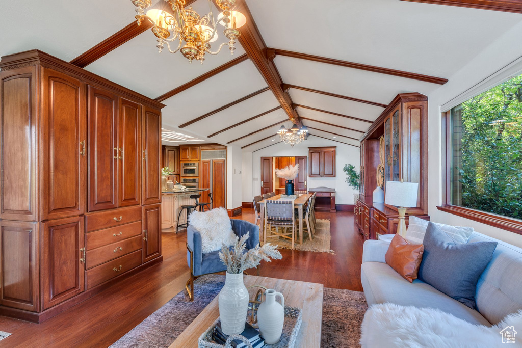 Living room featuring a chandelier and dark wood finished floors