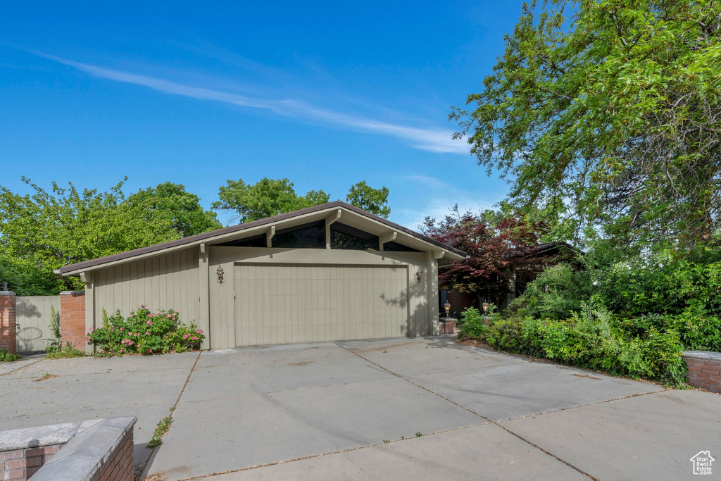 View of property exterior with a gate
