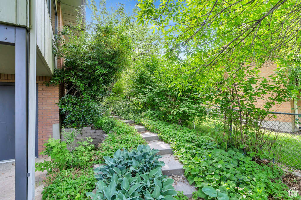 View of yard featuring fence