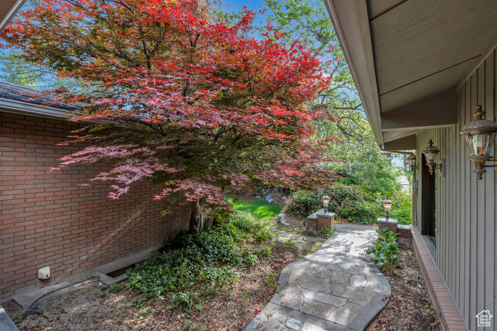 View of side of property featuring brick siding