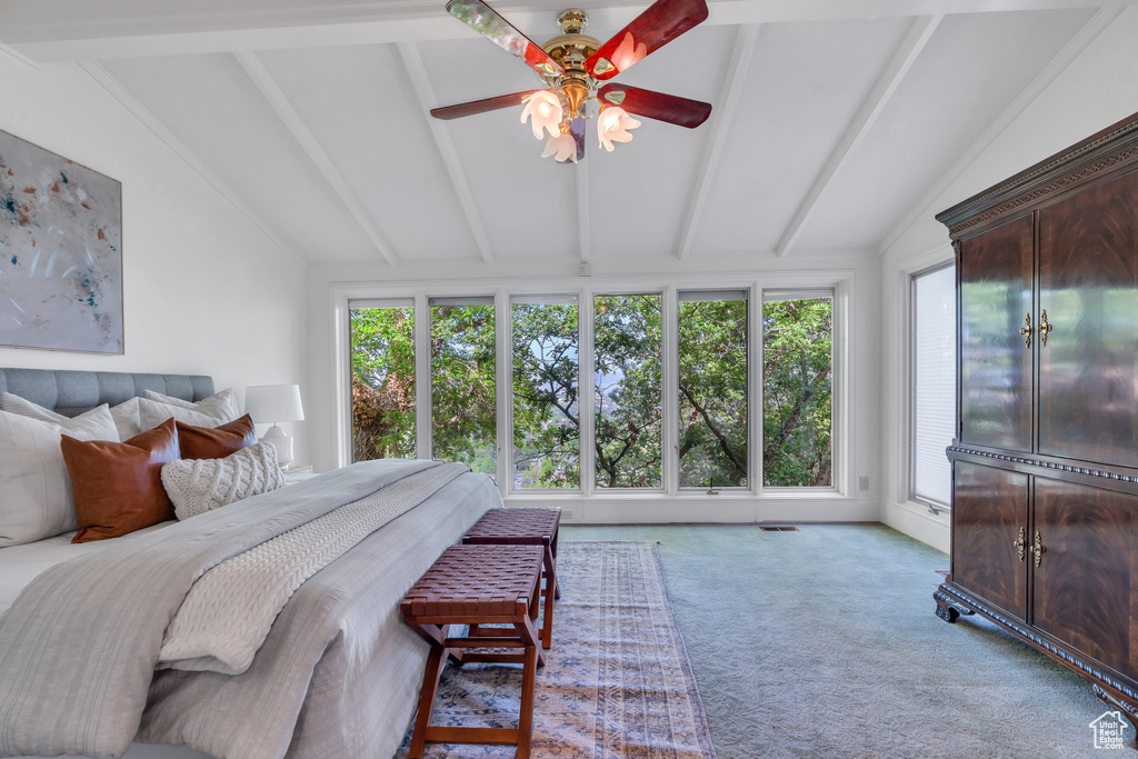 Bedroom featuring multiple windows and carpet