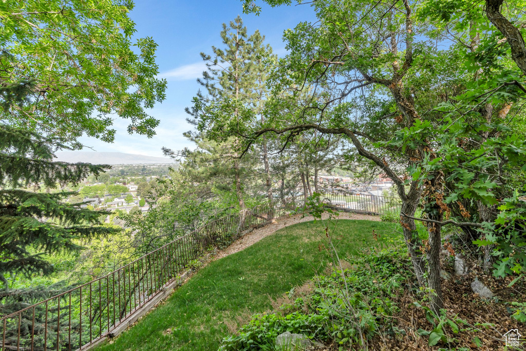 View of yard featuring fence