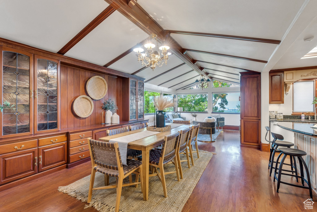 Dining space featuring a chandelier and wood finished floors