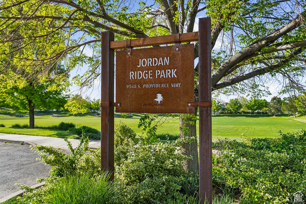Community / neighborhood sign with a lawn