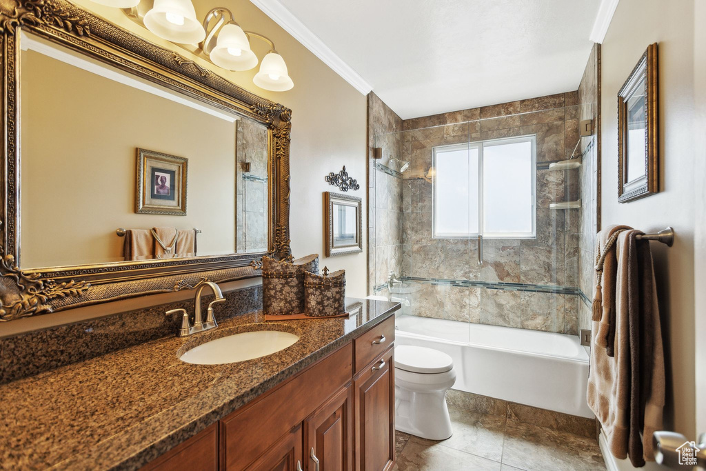 Bathroom featuring toilet, shower / bathtub combination, vanity, and crown molding