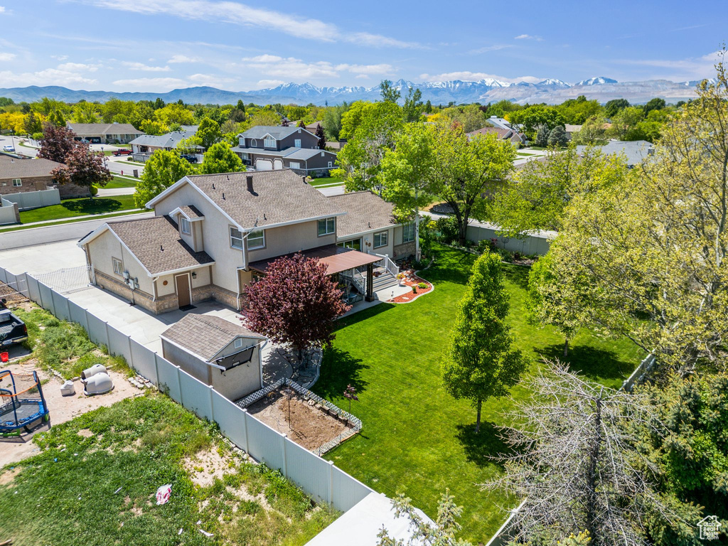 Aerial view of residential area featuring mountains