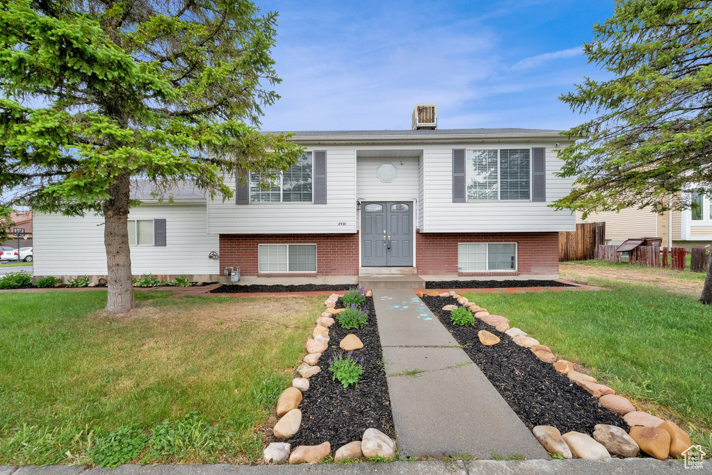 Split foyer home with brick siding