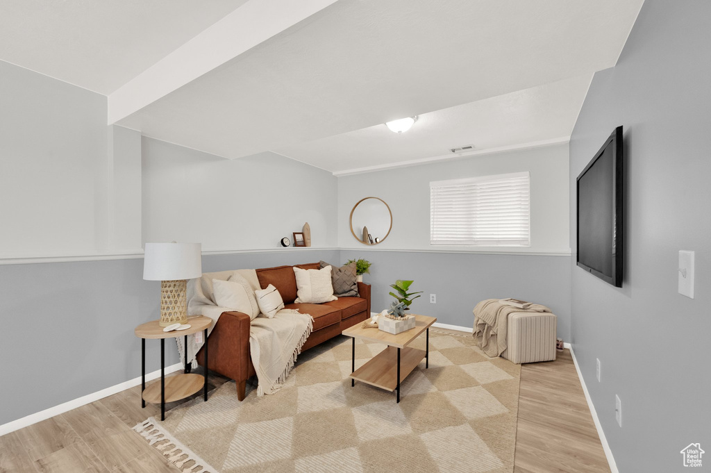 Living room with wood finished floors and baseboards