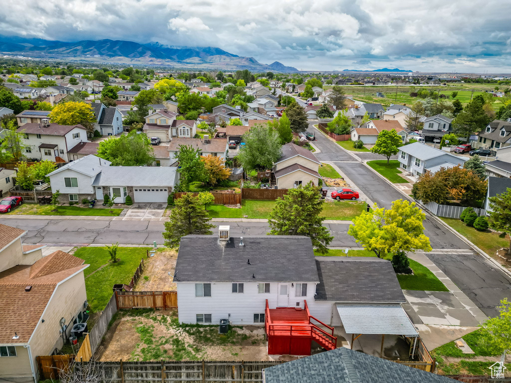 Aerial perspective of suburban area with a mountainous background