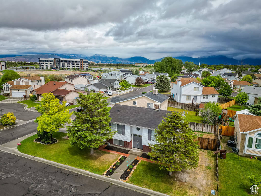 Aerial perspective of suburban area with a mountain backdrop